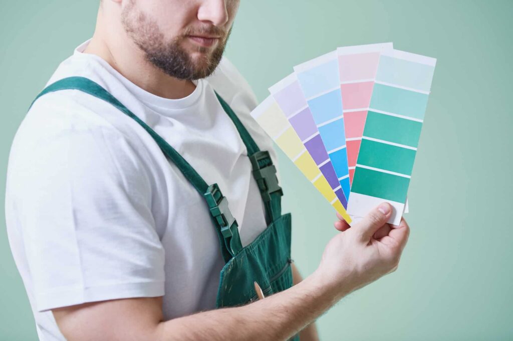 man holding color swatches